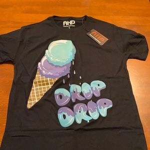 Black T shirt. “DRIP DRIP”